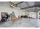 Spacious garage with storage and lawn equipment at 2428 Wildwood Ct, Winter Haven, FL 33884