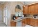 Spacious kitchen with granite countertops, wood cabinets, and stainless steel appliances at 2428 Wildwood Ct, Winter Haven, FL 33884
