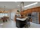 Spacious kitchen with granite countertops, stainless steel appliances, and an island at 2428 Wildwood Ct, Winter Haven, FL 33884