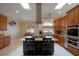 Gourmet kitchen featuring stainless steel appliances, granite counters, and an island at 2428 Wildwood Ct, Winter Haven, FL 33884