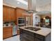 Island kitchen with stainless steel appliances and granite countertops at 2428 Wildwood Ct, Winter Haven, FL 33884