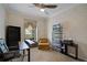 Home office with built-in shelving, desk, and comfortable seating at 2428 Wildwood Ct, Winter Haven, FL 33884
