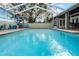 Inviting screened pool with tiled deck at 2428 Wildwood Ct, Winter Haven, FL 33884