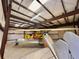 Spacious hangar interior with two airplanes, featuring high ceilings and ample storage space at 25 Aviation Dr, Winter Haven, FL 33881