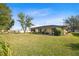Large backyard with patio and golf cart at 25 Aviation Dr, Winter Haven, FL 33881