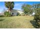 Large backyard with detached building and lush grass at 25 Aviation Dr, Winter Haven, FL 33881