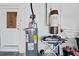 Unfinished basement with water heater and storage at 25 Aviation Dr, Winter Haven, FL 33881