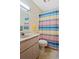Bathroom features a shower/tub combination, vanity and toilet at 25 Aviation Dr, Winter Haven, FL 33881