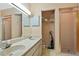 Bathroom with double sinks, shower and linen closet at 25 Aviation Dr, Winter Haven, FL 33881