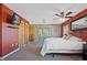 Bedroom with ceiling fan, sliding door to patio and en-suite bathroom at 25 Aviation Dr, Winter Haven, FL 33881