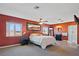 Spacious bedroom with ceiling fan, large windows, and en-suite bathroom at 25 Aviation Dr, Winter Haven, FL 33881