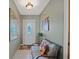 Bright entryway with tiled floor and seating area at 25 Aviation Dr, Winter Haven, FL 33881