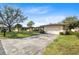 Single-story home with attached garage and landscaping at 25 Aviation Dr, Winter Haven, FL 33881