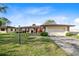 Single-story home with attached garage and well-manicured lawn at 25 Aviation Dr, Winter Haven, FL 33881