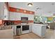 Kitchen boasts ample counter space, stainless steel appliances, and an open layout at 25 Aviation Dr, Winter Haven, FL 33881