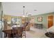 Open living area with dining space and access to patio at 25 Aviation Dr, Winter Haven, FL 33881