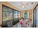 Sunroom with seating area, table and chairs, and view of backyard at 25 Aviation Dr, Winter Haven, FL 33881