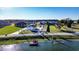 Wide shot of the property, including a lake and dock at 3001 Crystal Beach Rd, Winter Haven, FL 33880