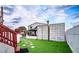 Artificial turf backyard with storage containers at 3001 Crystal Beach Rd, Winter Haven, FL 33880