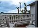 White balcony with two chairs overlooking water at 3001 Crystal Beach Rd, Winter Haven, FL 33880