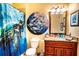 Bathroom with ocean-themed decor, granite vanity, and bathtub at 3001 Crystal Beach Rd, Winter Haven, FL 33880