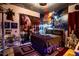 Star Wars themed bedroom with mural and R2-D2 figure at 3001 Crystal Beach Rd, Winter Haven, FL 33880