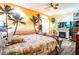 Tropical-themed bedroom with a mural and comfortable bed at 3001 Crystal Beach Rd, Winter Haven, FL 33880