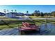 Small dock with bench overlooking lake at 3001 Crystal Beach Rd, Winter Haven, FL 33880