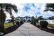 Landscaped entryway leading to a luxurious two-story house at 3001 Crystal Beach Rd, Winter Haven, FL 33880