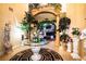 Stately entryway with high ceilings, ornate columns, and lush tropical plants at 3001 Crystal Beach Rd, Winter Haven, FL 33880
