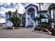 Grand two-story home with a circular driveway and lush landscaping at 3001 Crystal Beach Rd, Winter Haven, FL 33880