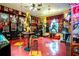 Retro game room featuring arcade games, movie posters, and collectibles at 3001 Crystal Beach Rd, Winter Haven, FL 33880