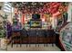 Home bar with seating and eclectic decor, including plants and artwork at 3001 Crystal Beach Rd, Winter Haven, FL 33880