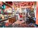 Fully stocked home bar with unique decor, seating, and game machine at 3001 Crystal Beach Rd, Winter Haven, FL 33880