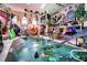 Indoor pool with tropical plants and various animal statues at 3001 Crystal Beach Rd, Winter Haven, FL 33880
