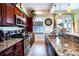 Kitchen boasts granite countertops and stainless steel appliances at 3001 Crystal Beach Rd, Winter Haven, FL 33880