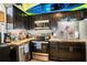 L-shaped kitchen with dark cabinetry and wood countertops at 3001 Crystal Beach Rd, Winter Haven, FL 33880
