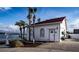 White lakehouse with a red roof and water views at 3001 Crystal Beach Rd, Winter Haven, FL 33880