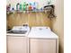 Laundry room with Samsung washer and dryer and storage shelves at 3001 Crystal Beach Rd, Winter Haven, FL 33880