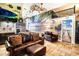 Relaxing living room with a tropical mural and leather seating at 3001 Crystal Beach Rd, Winter Haven, FL 33880