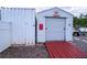 White storage shed with red ramp at 3001 Crystal Beach Rd, Winter Haven, FL 33880