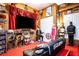 Retro movie-themed room with large screen TV, movie memorabilia, and seating at 3001 Crystal Beach Rd, Winter Haven, FL 33880
