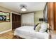 Bright bedroom with a comfortable bed and wood-look floors at 3100 Peacock Ln, Mulberry, FL 33860