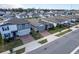 Aerial view of a residential neighborhood with houses and solar panels at 3285 Weitzel Dr, Haines City, FL 33844