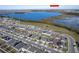Aerial view showcasing a house's location near a lake at 3285 Weitzel Dr, Haines City, FL 33844