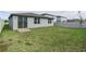 Spacious backyard with grassy lawn and privacy fence at 3285 Weitzel Dr, Haines City, FL 33844