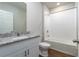 Clean bathroom with a granite vanity and a bathtub at 3285 Weitzel Dr, Haines City, FL 33844