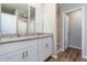 Double vanity bathroom with granite countertops at 3285 Weitzel Dr, Haines City, FL 33844