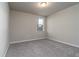 Simple bedroom with neutral walls and carpet flooring at 3285 Weitzel Dr, Haines City, FL 33844