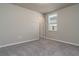 Simple bedroom with a window and neutral decor at 3285 Weitzel Dr, Haines City, FL 33844